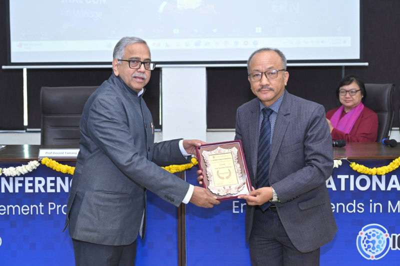 Guest being felicitated with a memento at the 3rd ICETMP