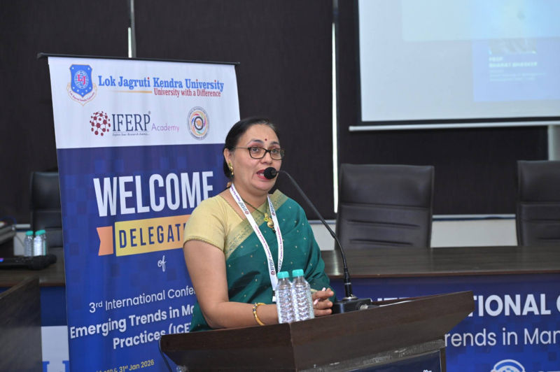 Speaker at the podium in front of the Welcome Delegates banner, 3rd ICETMP