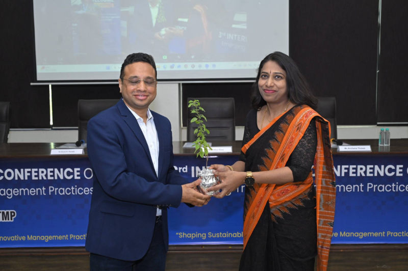 Guest presented with a plant as a token of appreciation at the 3rd ICETMP