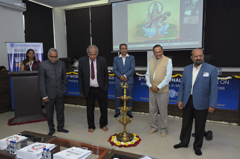 Guests lighting the ceremonial lamp at the inauguration of the 3rd ICETMP