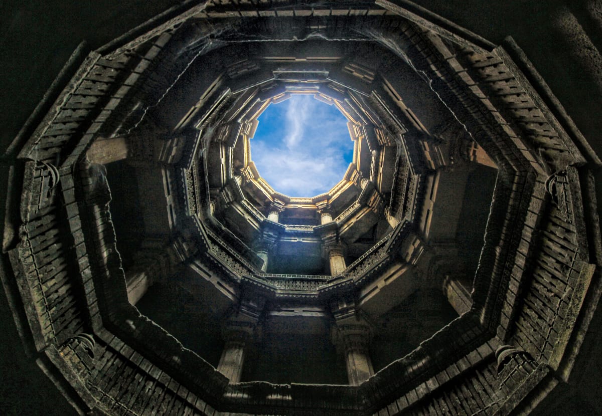 Carved stone pillars and arches descending into Dada Harir Ni Vav stepwell
